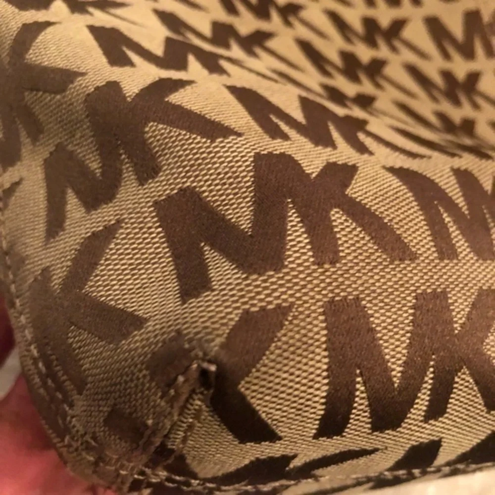 Michael kors brown monogram tote bag with blue leather trim